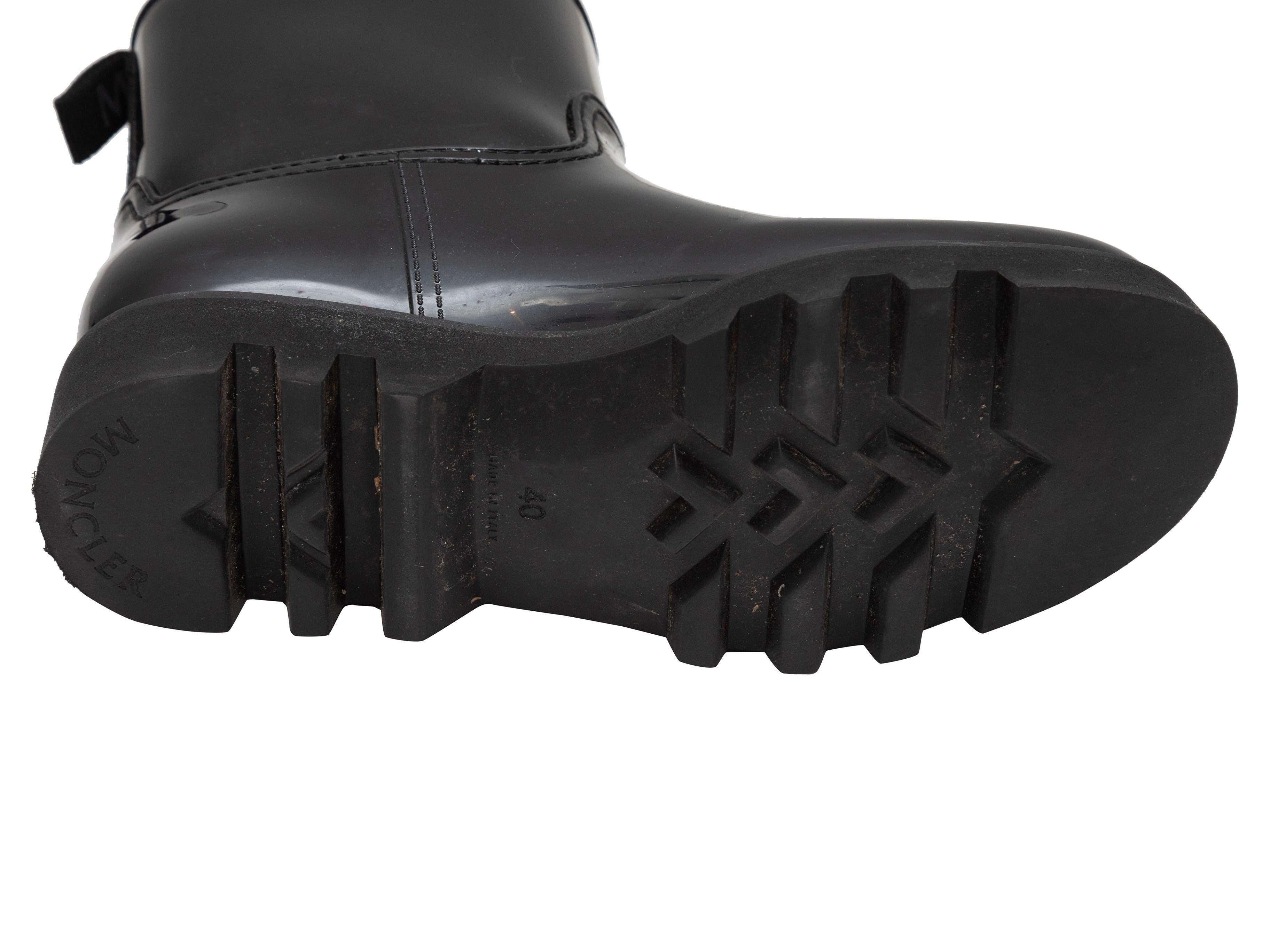 Product Details: Black short rubber rain boots by Moncler. Lug soles. 6.5