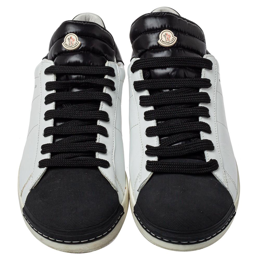 Designed into a classic silhouette, these Moncler sneakers are closet staples. Crafted from leather in white and black shades, the exterior is detailed with neat stitches, laces on the vamps, and logo-accented tongues.

Includes: Original Box,