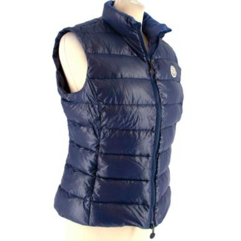 Moncler Blue Quilted Down Gilet

- Blue puffer gilet with front logo patch 
- 2 zipped side pockets
- High neck 
- Soft water resistant fabric 
- Blue zip down the front with black logo zippers 

Made in Romania 
Shell: 100% polyamide 
Padding: Down