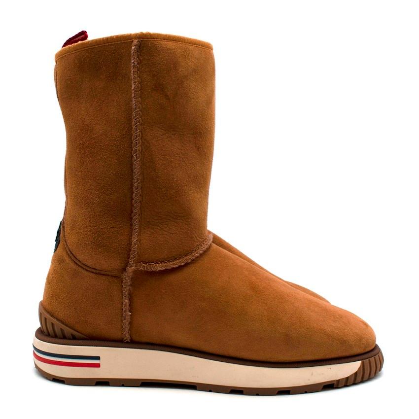 Moncler Brown Gaby shearling-lined Boots

Moncler's tan Gaby boots are crafted from soft sheepskin and feature a warm fur lining, making them a perfect option for cold winter days. The robust rubber sole and pull tabs are adorned with the label's