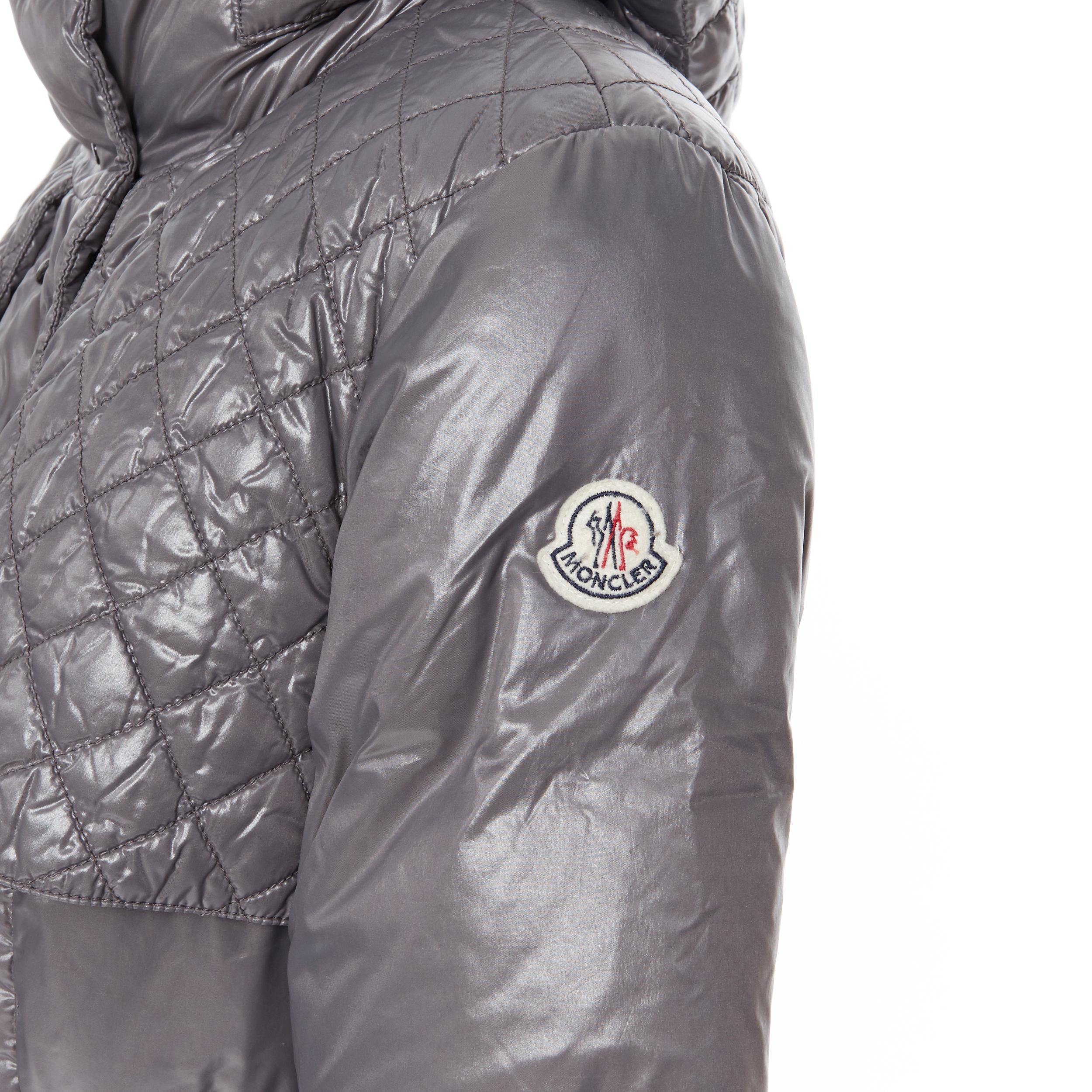 MONCLER Carson grey quilted genuine goose down feather padded puffer coat Sz 2 M 
Reference: CEWG/A00012 
Brand: Moncler 
Material: Nylon 
Color: Grey 
Pattern: Solid 
Closure: Zip 
Extra Detail: Genuine down feather padding. 

CONDITION: