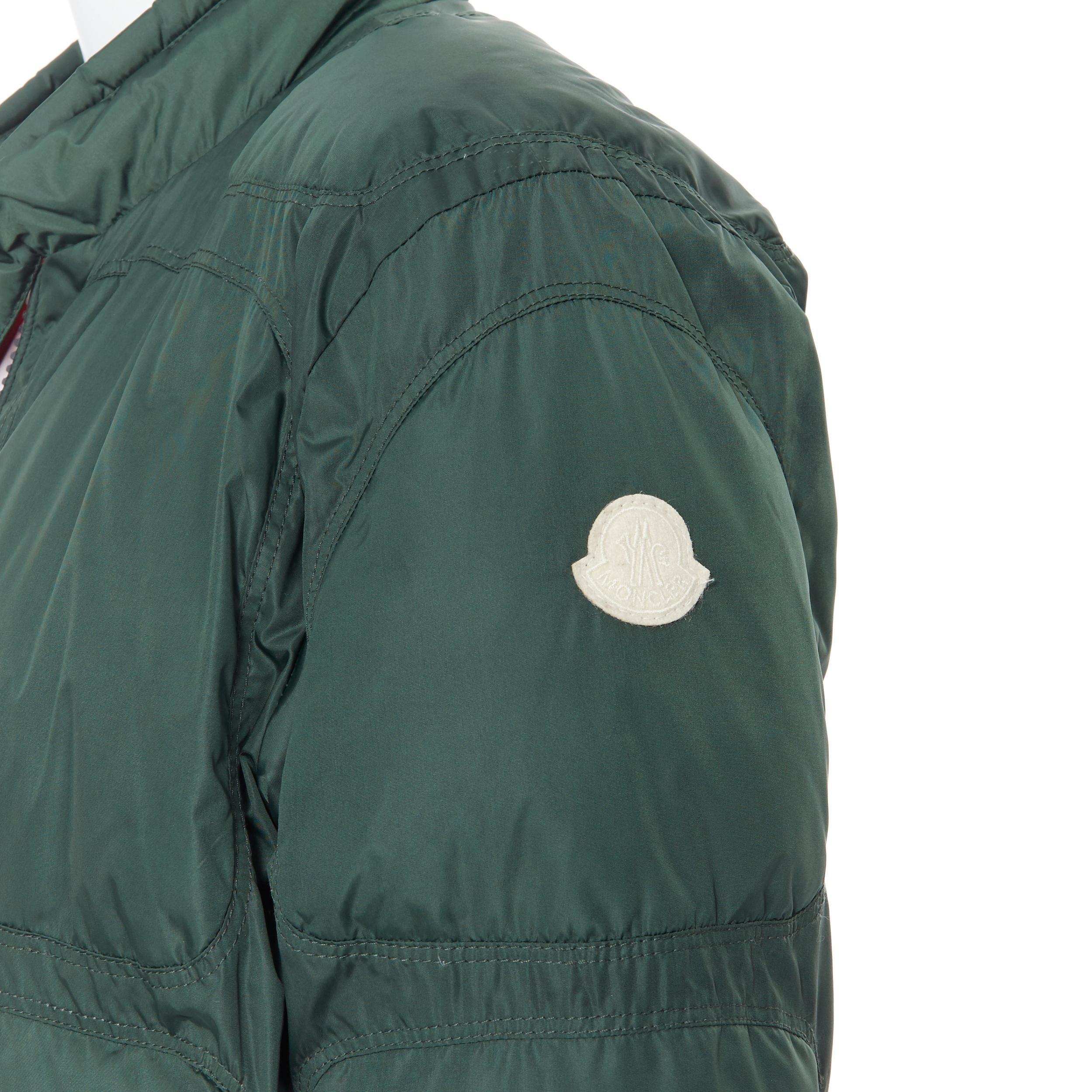 MONCLER Cheriton Giubbotto green down feather padded puffer winter jacket US3 L
Brand: Moncler
Model Name / Style: Padded jacket
Material: Nylon, down
Color: Green
Pattern: Solid
Closure: Zip
Extra Detail: Down padded. Contrast red lining. Long