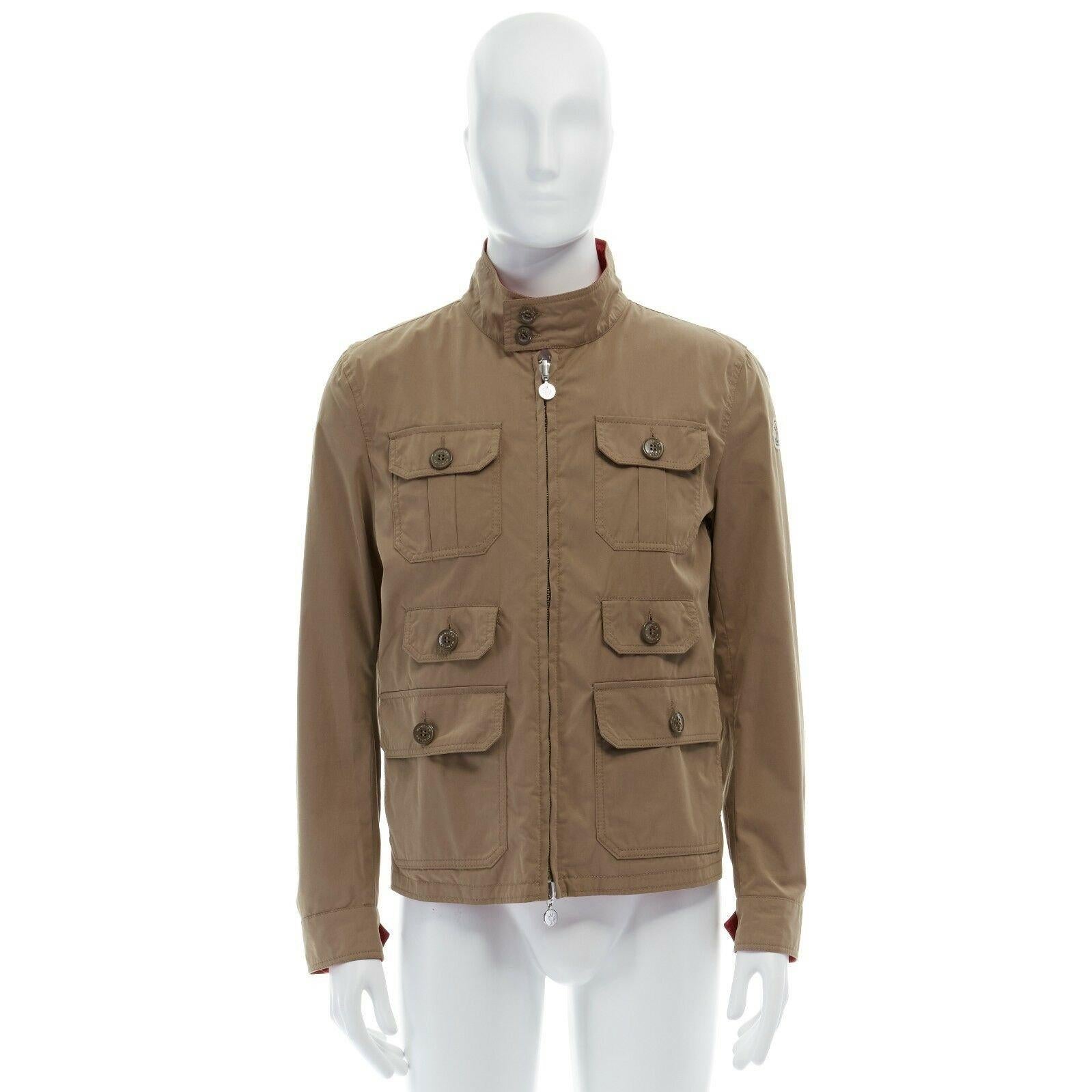 MONCLER Colisee beige cotton flap pocket red nylon lined reversible field jacket 
Reference: TGAS/A02531 
Brand: Moncler 
Material: Cotton 
Color: Beige 
Pattern: Solid 
Closure: Zip 
Extra Detail: Colisee jacket. Beige cotton outer. 6 flap pocket