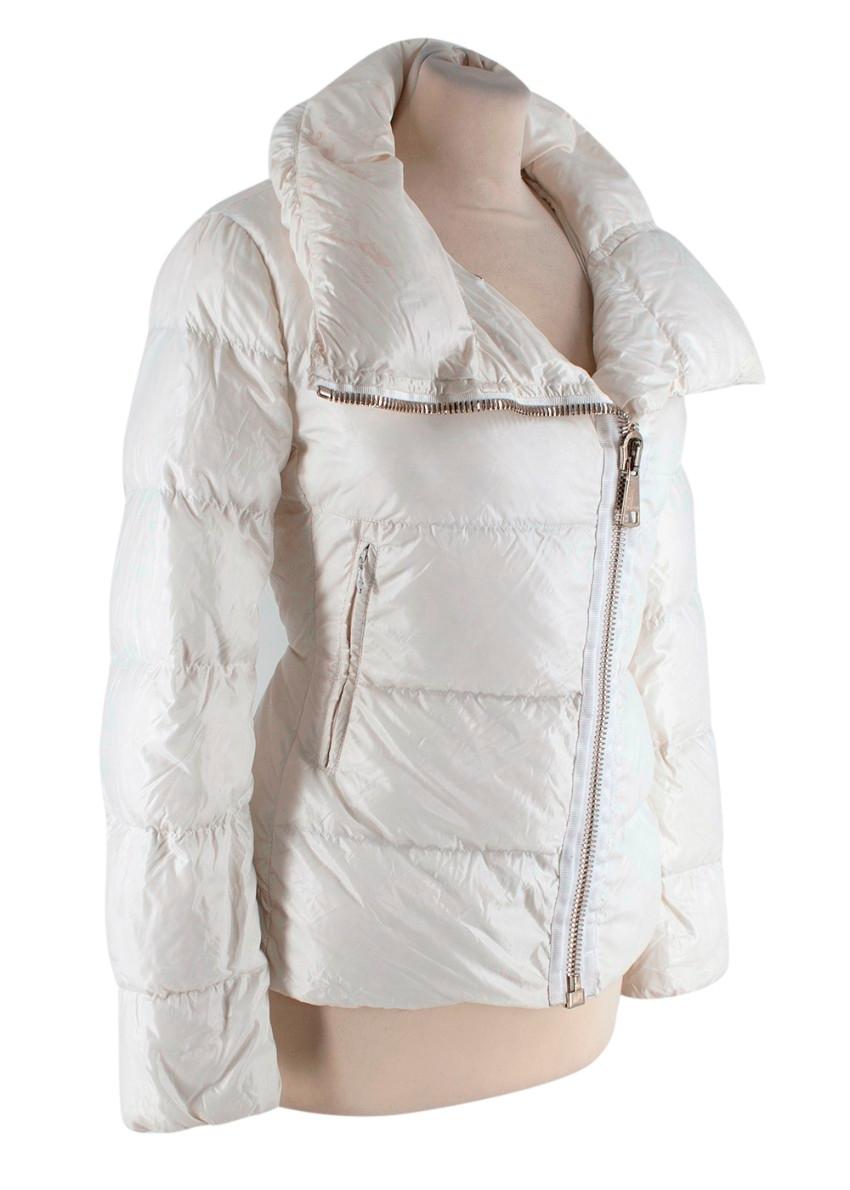 Moncler Cream Nylon Padded Down Jacket
 

 - Padded cream jacket with linear quilting
 - Two front zipped pockets
 - Asymmetric gold-tone zip fastening, shawl collar
 - Elasticated cuffs
 - Cinched waist silhouette
 

 Materials:
 100% Nylon
 Down
