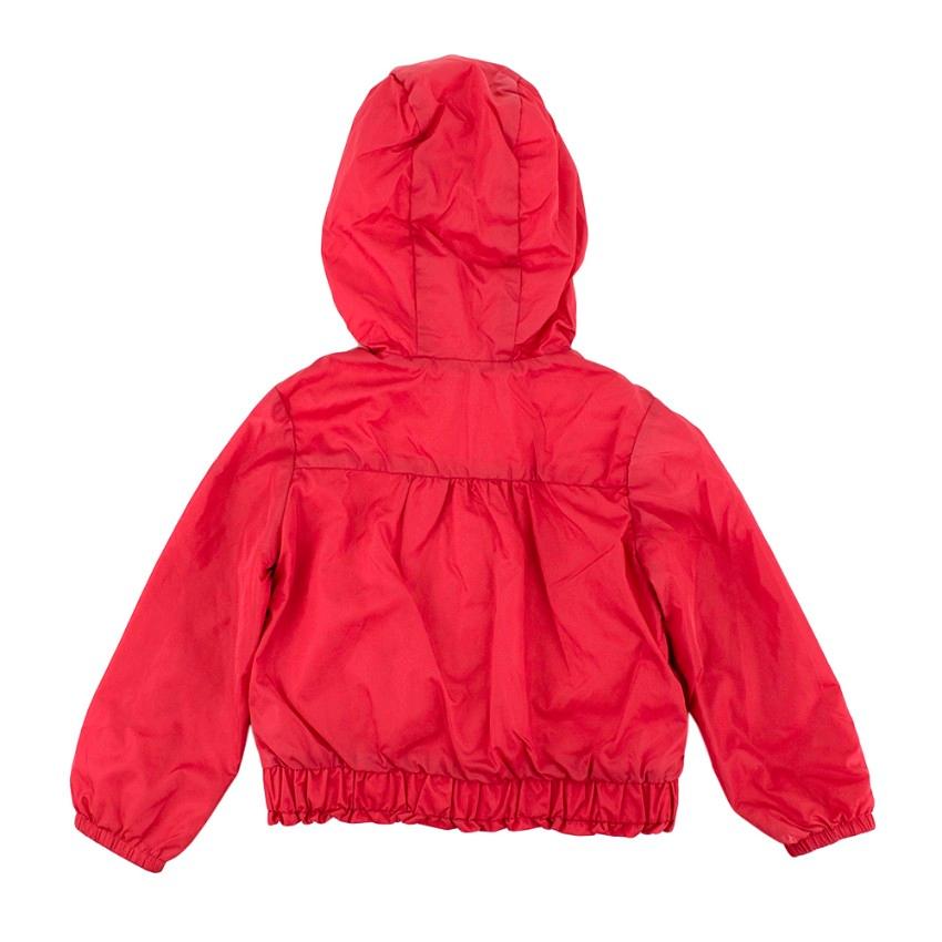 Moncler Dark Pink Hooded Jacket 

- Front zip fastening 
- Slip pockets 
- Frilly trim detail on bottom hem
- Gathered back of coat 

Materials:
Exterior fabric:
- 100% Nylon
Lining:
- 100% Cotton
Hood lining:
- 100% Cotton
Sleeves lining:
- 100%
