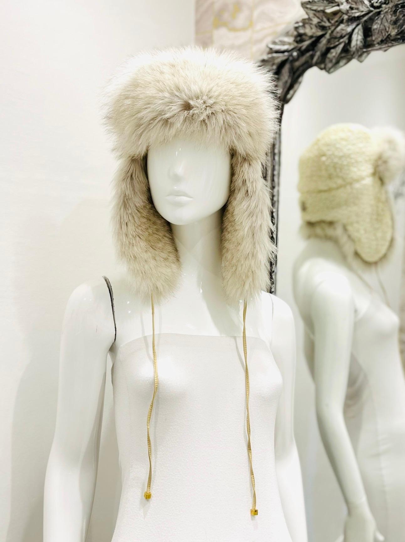 Moncler Fox Fur Hat

Ivory winter cap crafted from bubble quilted nylon with fox fur lining and trims.

Detailed with signature 'Moncler' logo to rear and two cords on either side. Rrp £370

Size – One Size

Condition – Very Good (Cracking leather