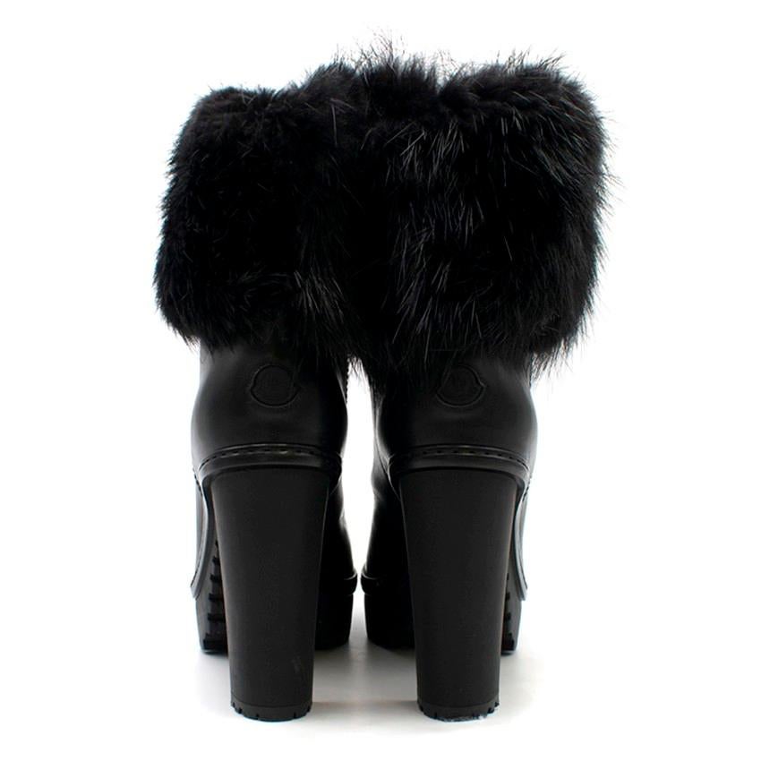 Moncler Fur Trimmed Black Cleated Sole Platform Boots

- Black leaher boots
- High block heel and platform with cleated soles
- Round toe
- Moncler rubber patch at back of heel
- Black fur trimmed
- Pull-on style
- Dust bag included

Please note,