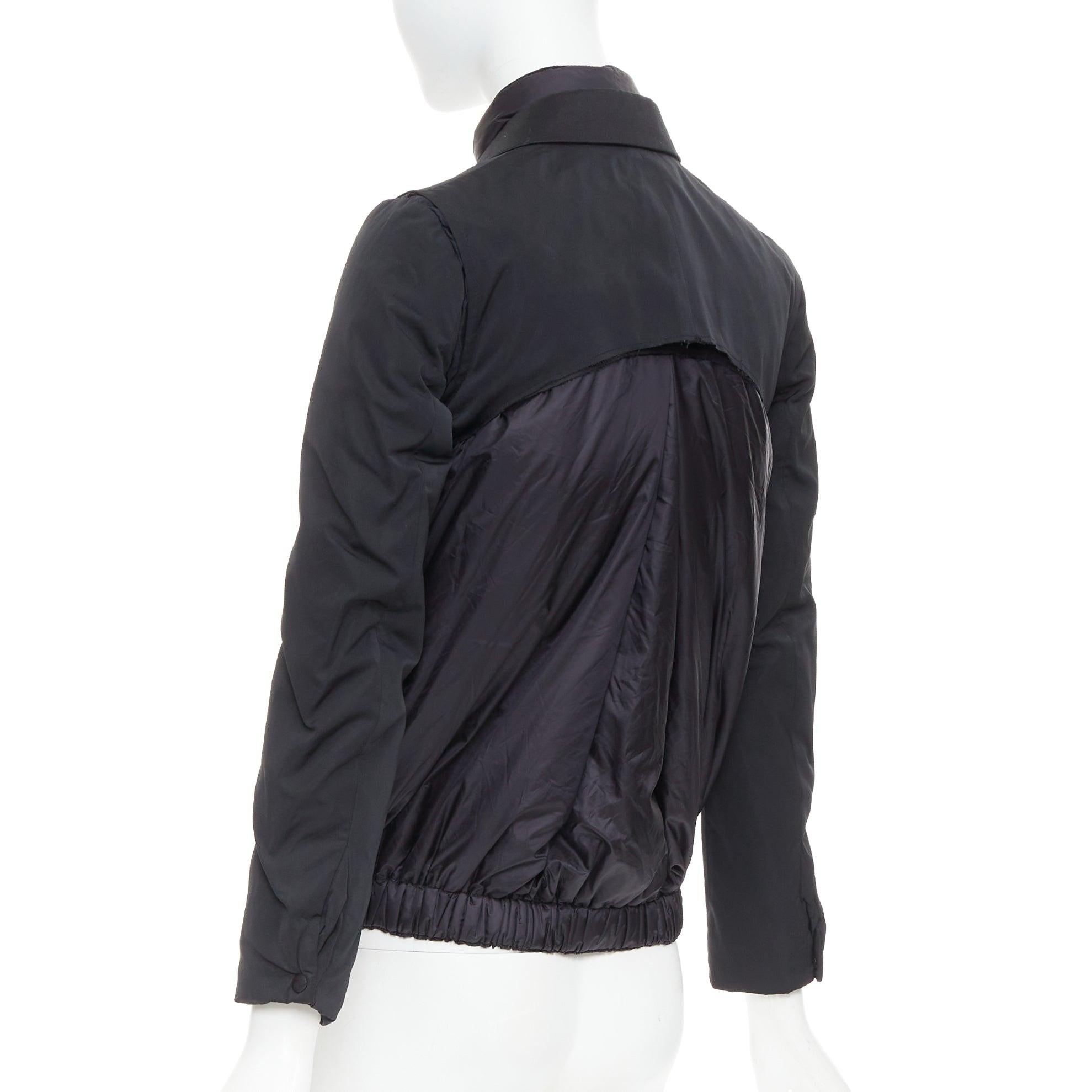 MONCLER G32-003 black layered down filled puffer tuxedo blazer top
Reference: CAWG/A00306
Brand: Moncler
Model: G32-003
Material: Fabric
Color: Black
Pattern: Solid
Closure: Button
Lining: Black Down
Made in: Italy

CONDITION:
Condition: Fair, this