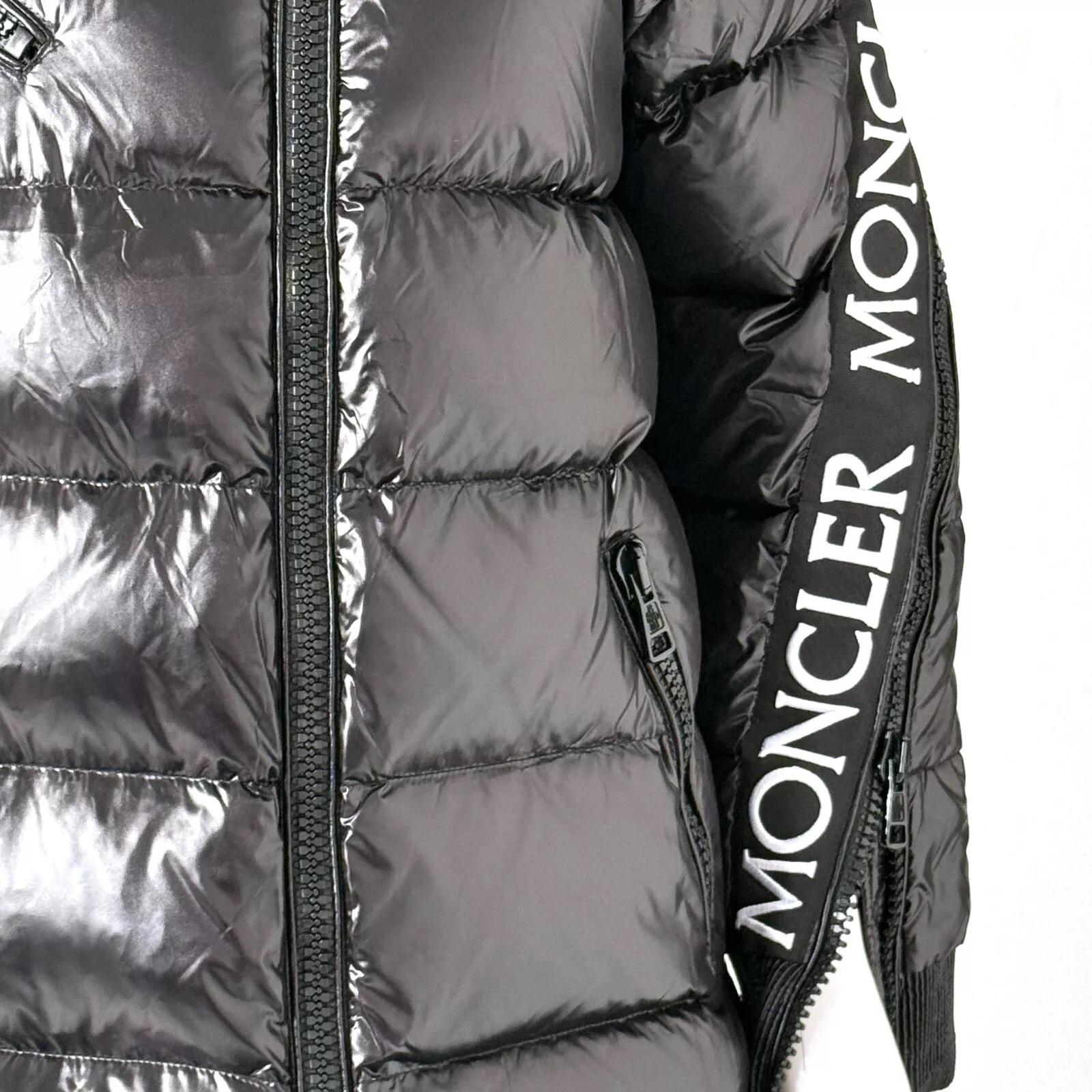 MONCLER GENIUS  WOMEN PUFFER JACKET 
Color: Black with multicolor monogram print
Material: 100% Polyamide, Combo 100% Polyester, Fill 90% Down, 10% Feather
Condition: Excellent 
Made in Frence
Condition: Excellent  

Measurements:
Bust: 40