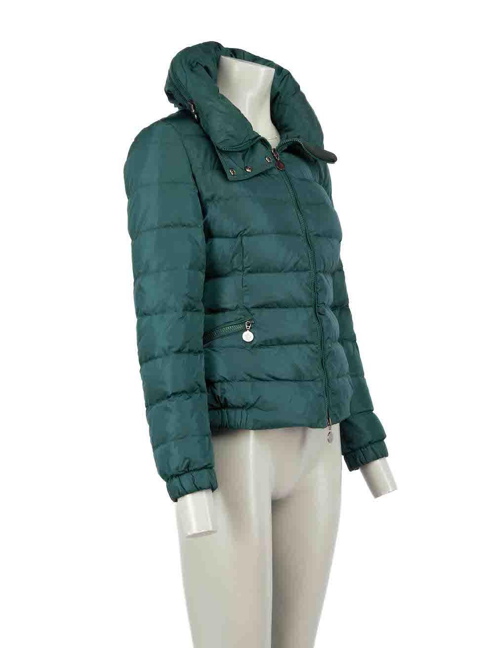 CONDITION is Good. Minimal wear to coat is evident. Minimal wear to the right underarm lining with the unstitching of the seam. Both external sleeves also have plucks to the weave and the right sleeve has areas of unstitching on this used Moncler