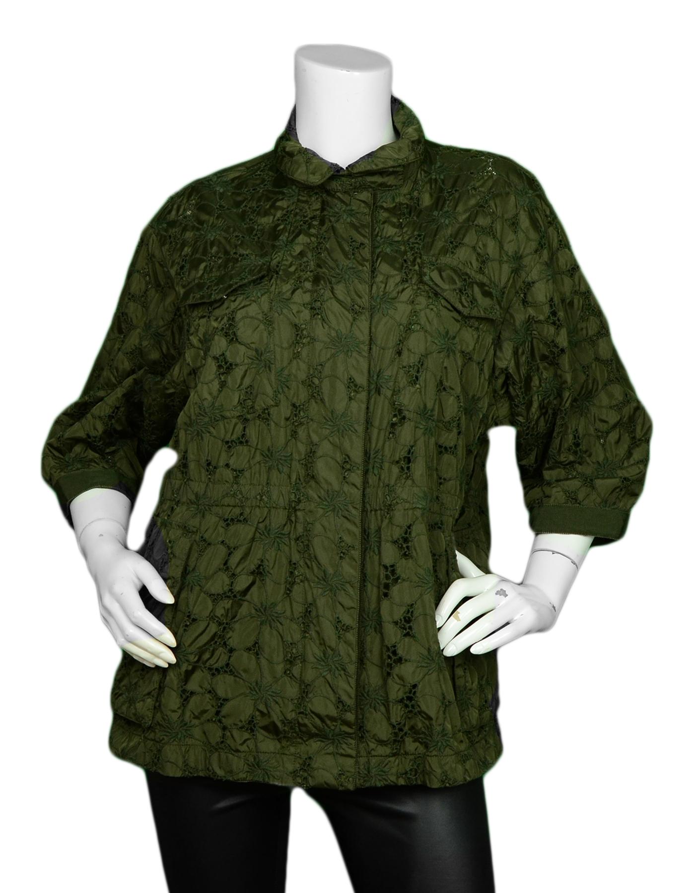 Moncler Green Tatin Lace Eyelet 3/4 Sleeve Jacket sz 2

Made In: Romania 
Color: Dark Green
Materials: 100% Nylon
Embroidery: 85% Cotton, 15% Polyester  
Lining: 100% Nylon
Opening/Closure: Front zip-up
Overall Condition: Excellent pre-owned