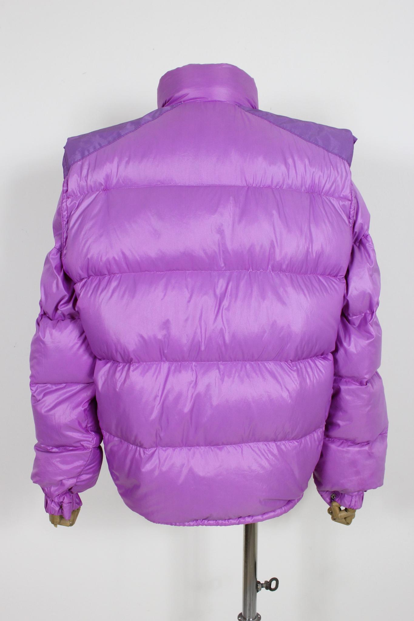 Moncler grenoble vintage 80s padded jacket. The jacket has a double fit both as a gilet with removable sleeves with a zip. Closure with zip and clip buttons, adjustable waist laces. Monogram pattern on the shoulders with tone-on-tone Moncler logo.