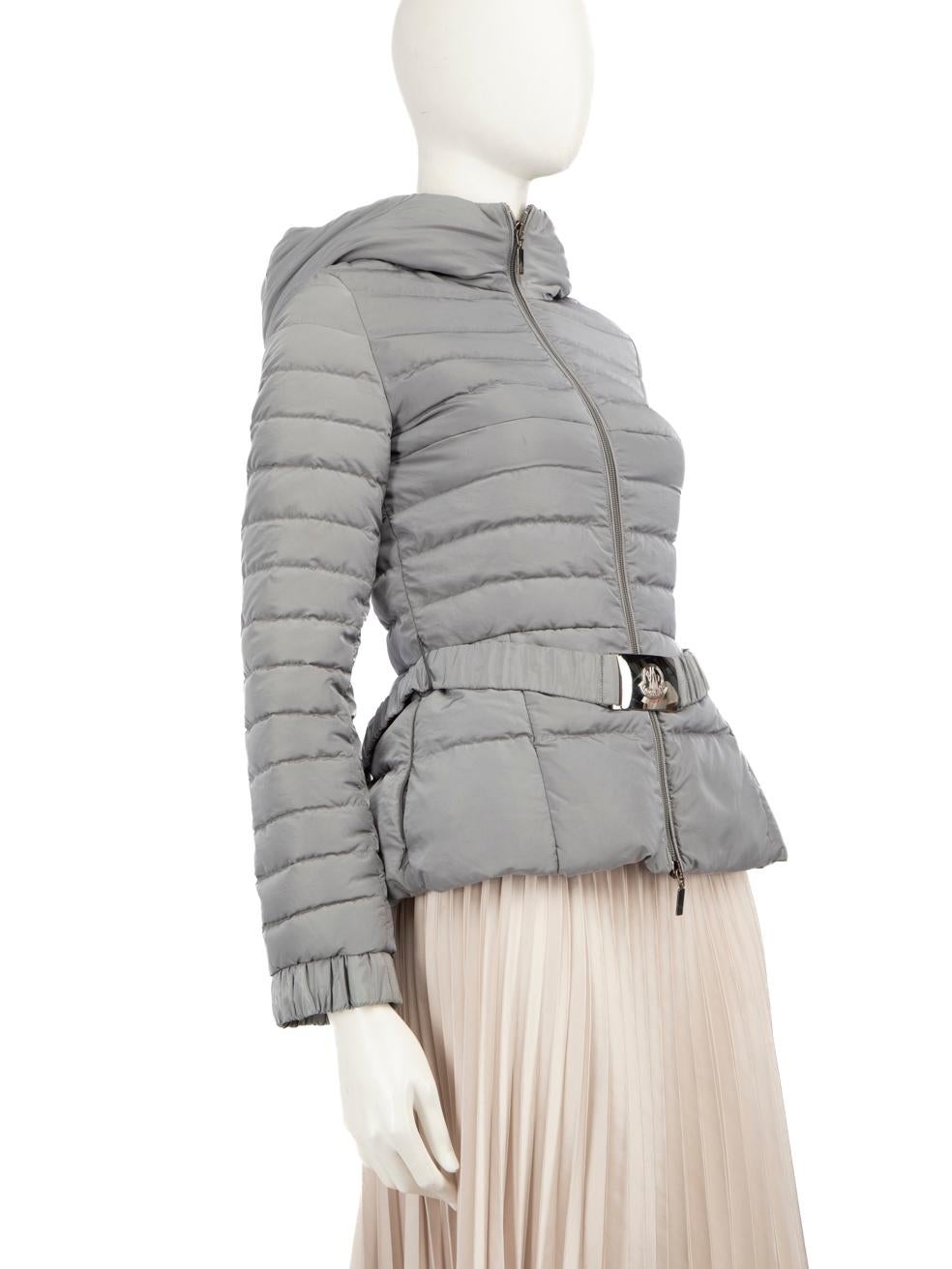 CONDITION is Very good. Minimal wear to the coat is evident, there are some marks at the bottom of the front left panel and light scratches on the belt. The elasticated belt hoop on the right side of the coat is overstretched and the centre zip is