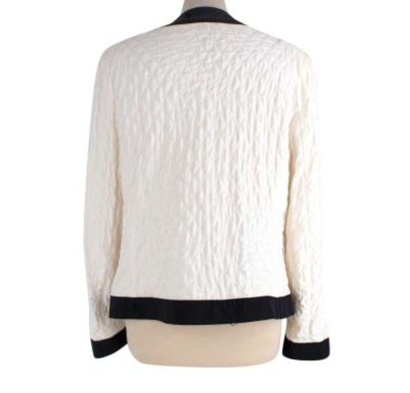 Moncler Ivory Quilted Gracie Jacket

- quilted ivory & black body
- straight fitting jacket. 
- 4 exterior buttoned pockets. 

Made in Romania.
Do not wash.
Condition 9/10 - Please note there is a light mark to the body, priced accordingly

PLEASE