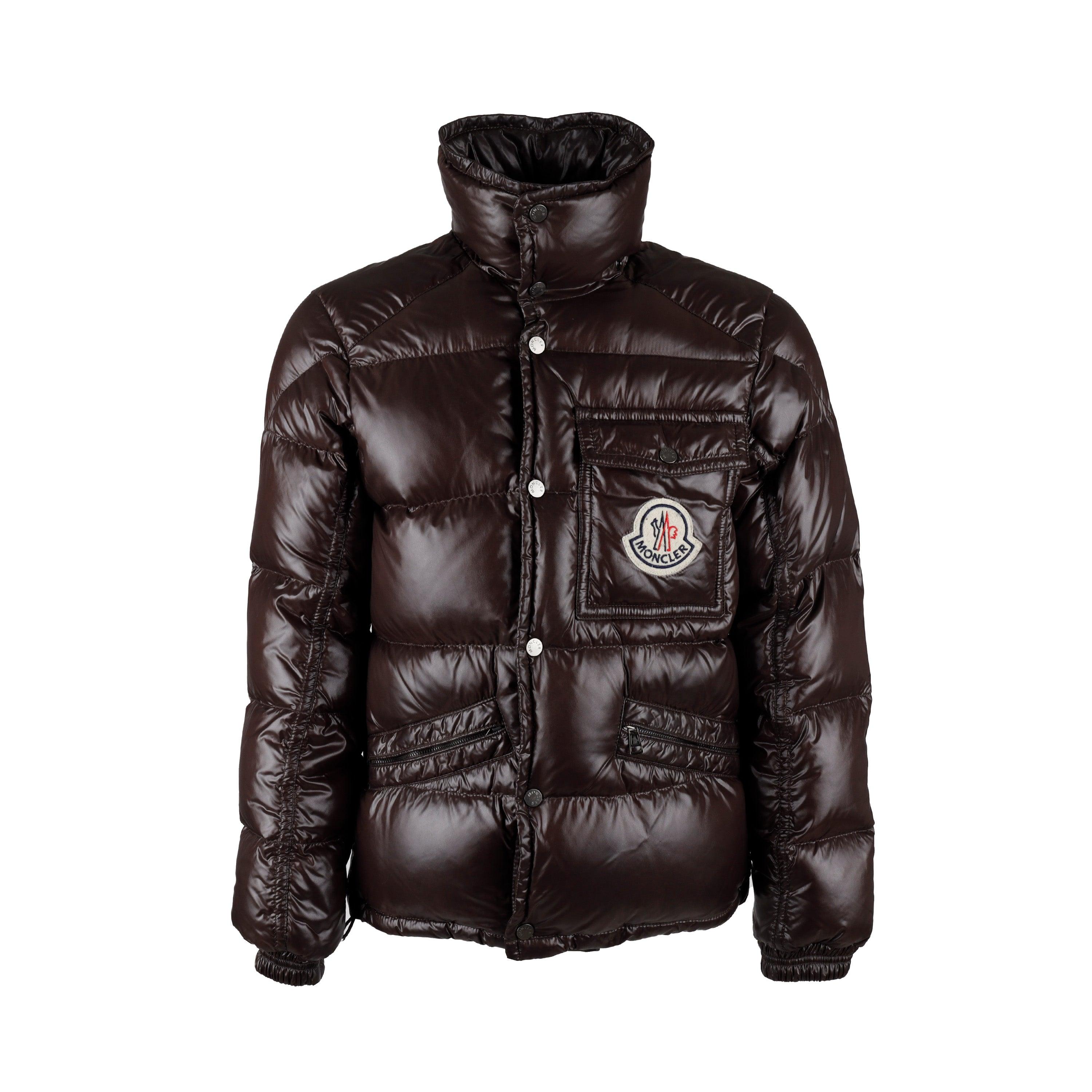 Experience the iconic Moncler look with this glossy dark brown K2 Down Jacket. Filled with down for superior insulation in cold climates, the jacket features a double snap-button closure, two zipped outer pockets, and the signature Moncler patch
