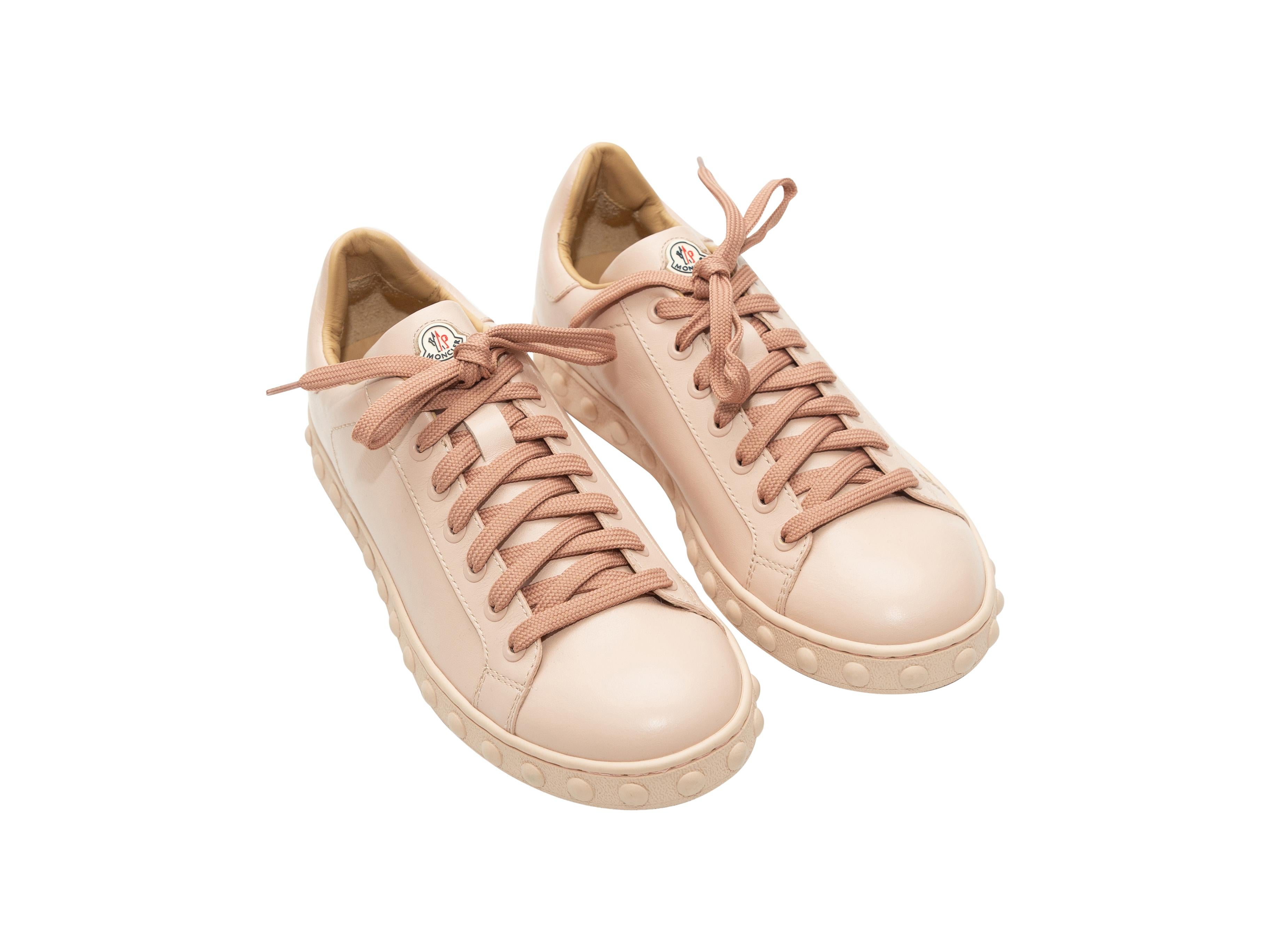 Product details: Light pink leather round-toe sneakers by Moncler. Stud embellishment trim at outer soles. Lace-up tie closures at tops. Designer size 37.
Condition: Pre-owned. Excellent.
Est. Retail $ 600.00
