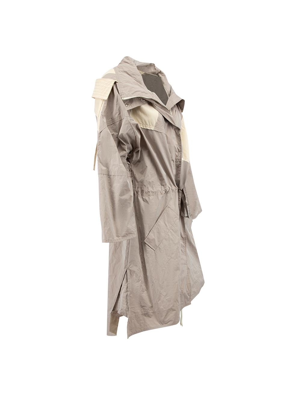 CONDITION is Never worn, with tags. No visible wear to coat is evident on this new Moncler Genius designer resale item.
  
  Details
  Grey
  Polyester
  1952 Freesia Long model
  Long raincoat
  Contrast panelled
  Hooded
  Front double zip closure