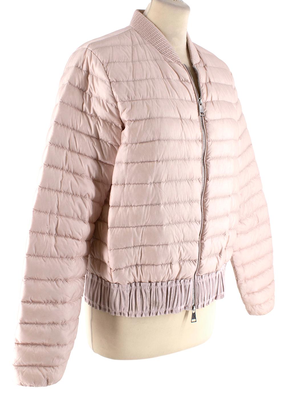 Moncler Pink Quilted Jacket

- Side slip pockets 
- Textured trims 
- Elasticated cuffs 
- Front zip fastening 
- Inside patch pockets 

Materials:
Exterior:
- 100% Nylon 
Lining:
- 100% Nylon 
Details padding:
- 100% Polyester 
Material 1:
- 50%