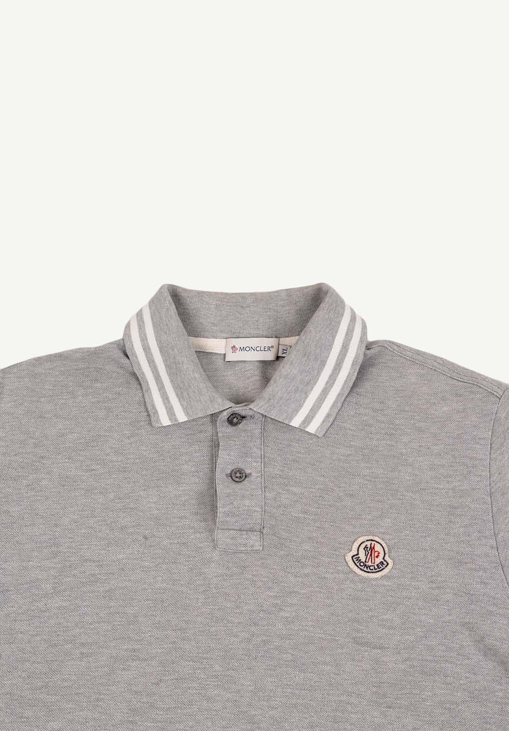 Item for sale is 100% genuine Moncler Polo Shirt Men T-Shirt 
Color: Grey
(An actual color may a bit vary due to individual computer screen interpretation)
Material: Cotton, missing care label. 
Tag size: XL runs smaller like M/L
This t shirt is