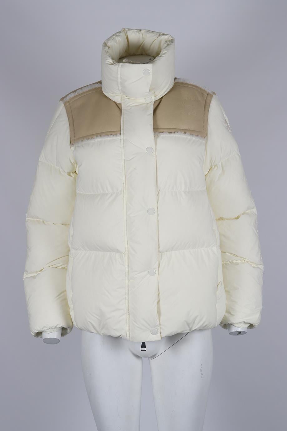 Moncler Shearling Trimmed Quilted Shell Down Jacket. Cream and beige. Long Sleeve. Turtleneck. Button and zip fastening - Front. 90% Down, 10% feathers; lining: 70% polyamide, 30% polyester; material: 70% polyamide, 30% polyester. 1 (UK 8, US 4, FR