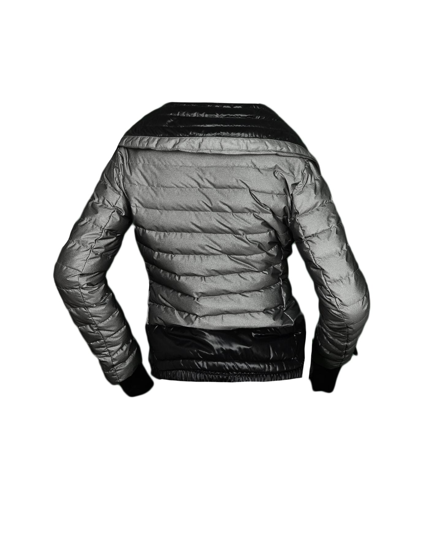 Moncler Silver Down Puffer Jacket sz 0

Made In: Romania
Color: Silver, Black
Materials: 86% Polyester, 14% Polyamide
Lining: 100% Nylon
Filling: 90% Down, 10% Feather
Opening/Closure: Front zip
Overall Condition: Excellent pre-owned condition

Tag