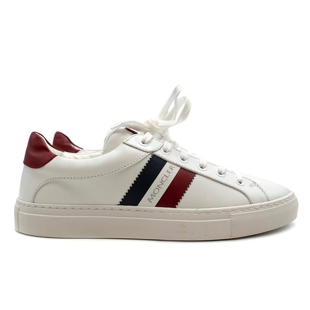 Moncler White Ariel Low-Top Leather Sneakers

- Size 38.5
- White Moncler trainers in soft leather
- White rubber sole
- Moncler coloured stripes on the side with logo
- Red heel backs
- Round toe shape
- Brand new
- Moncler logo on the tongue
-