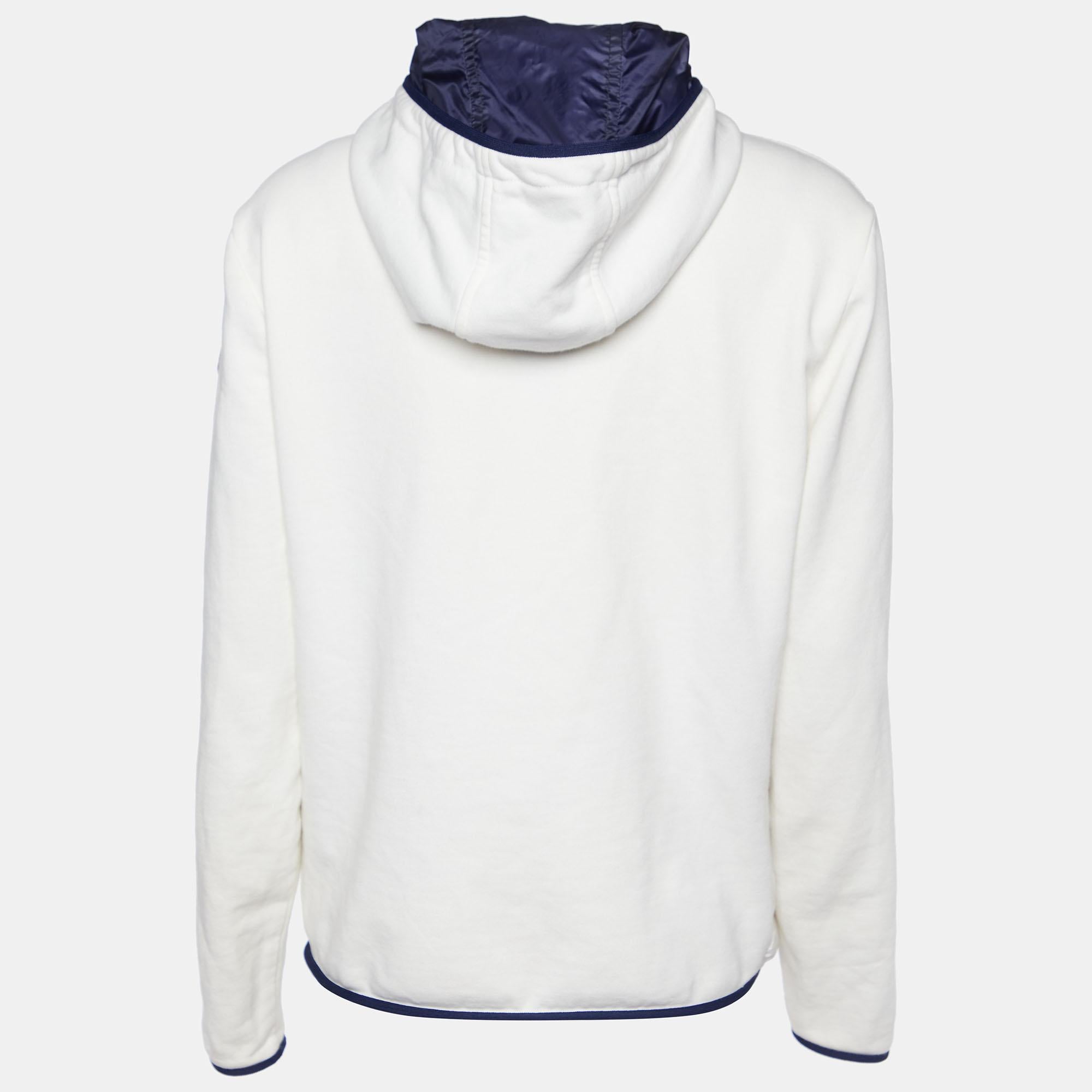 The Moncler cardigan blends luxury and comfort seamlessly. Crafted with exquisite attention to detail, it features a quilted body and knit sleeves for a stylish contrast. The cozy hood and zip-up design offer both warmth and versatility for any