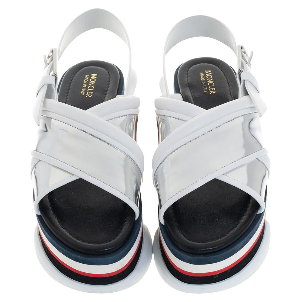 These sandals from Moncler are truly a maker of trends. The sandals are designed with crisscross straps on the vamps made from silver patent leather and trimmed with white leather. Finished with buckled slingbacks, this pair of platform Zelda