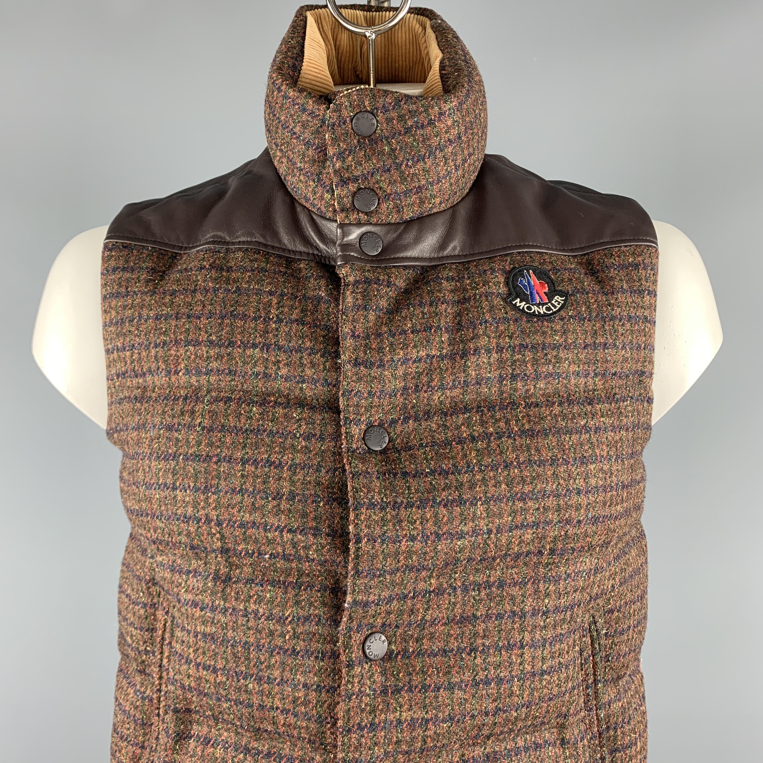 MONCLER x JUNYA WATANABE vest comes in a brown tweed wool featuring a corduroy collar, leather trim, zipper pockets, green liner, and a zip & snap button closure.

Excellent Pre-Owned Condition.
Marked: M

Measurements:

Shoulder: 16.5 in. 
Chest:
