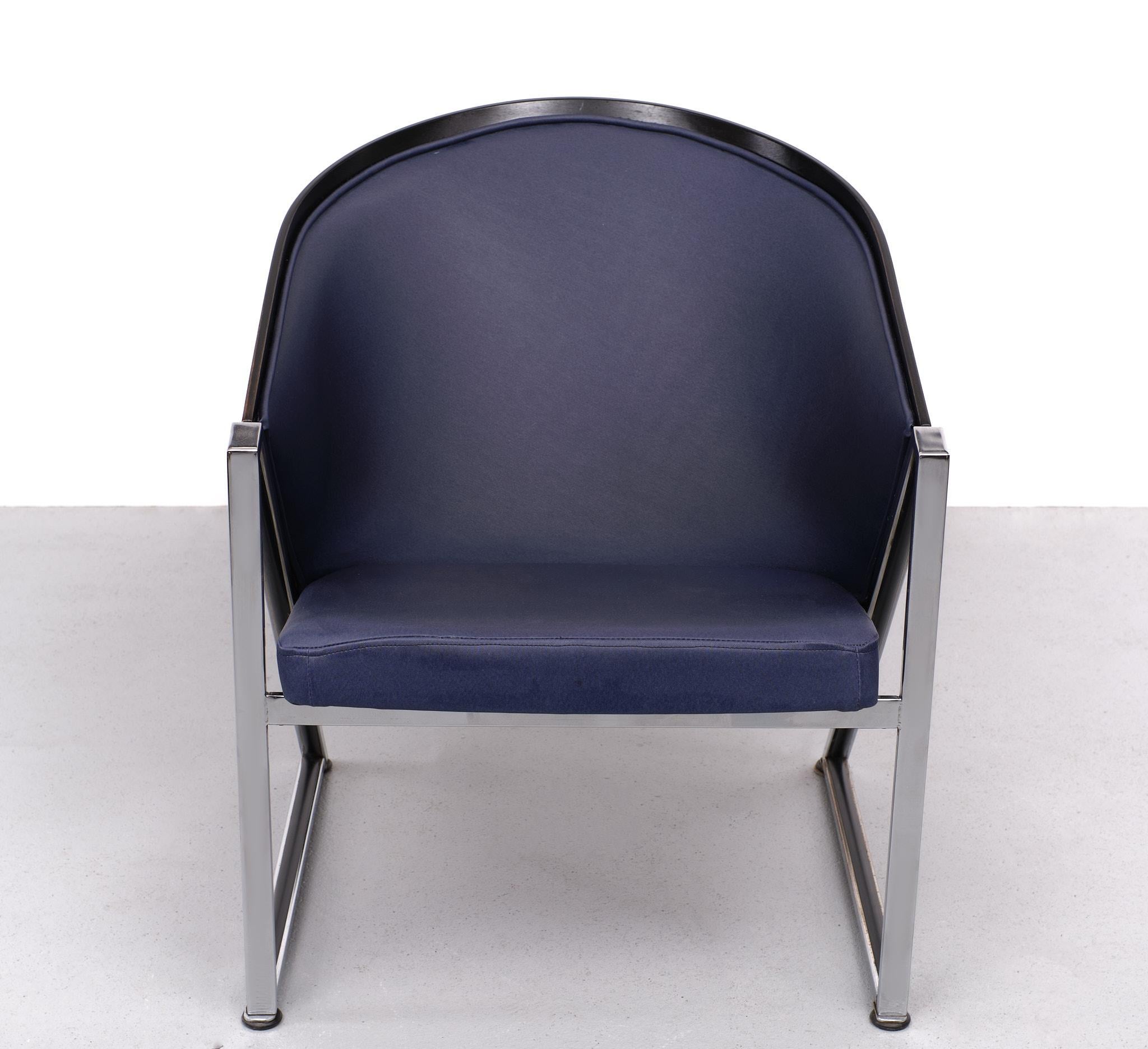 Very nice post modern mondi soft chair designed by the Finnish architect Jouko Jarvisalo for Innocences OY Finland in the 1980s. The chair features a heavy chromed frame with a lacquered plywood shell ,blue vinyl upholstery. Remains in very good