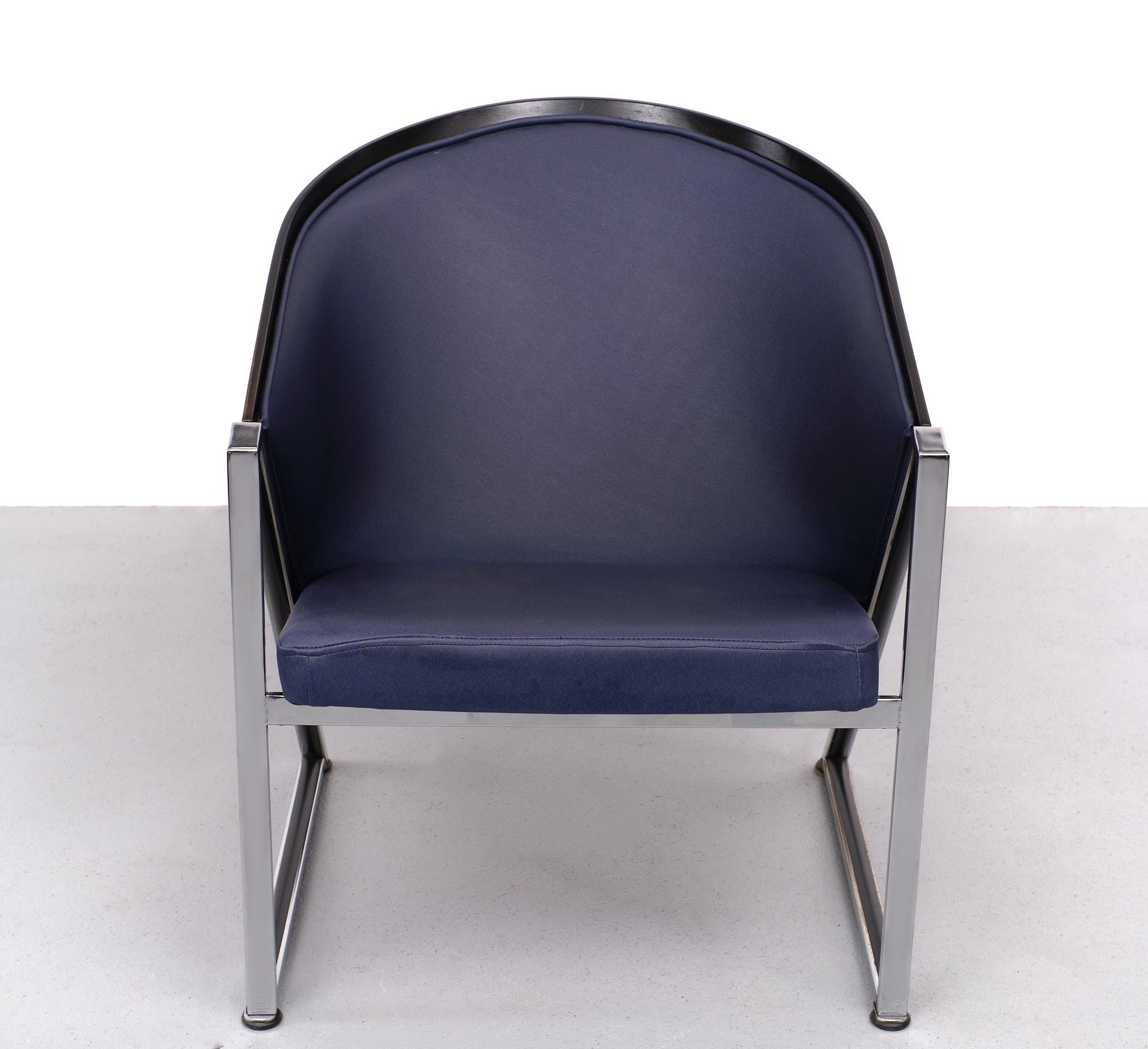 Memphis style Mondi Soft chair designed by the Finnish architect Jouko Jarvisalo for Innocences OY Finland in the 1980s. The chair features a heavy chromed frame with a lacquered plywood shell and Blue upholstery. Remains in  good condition.