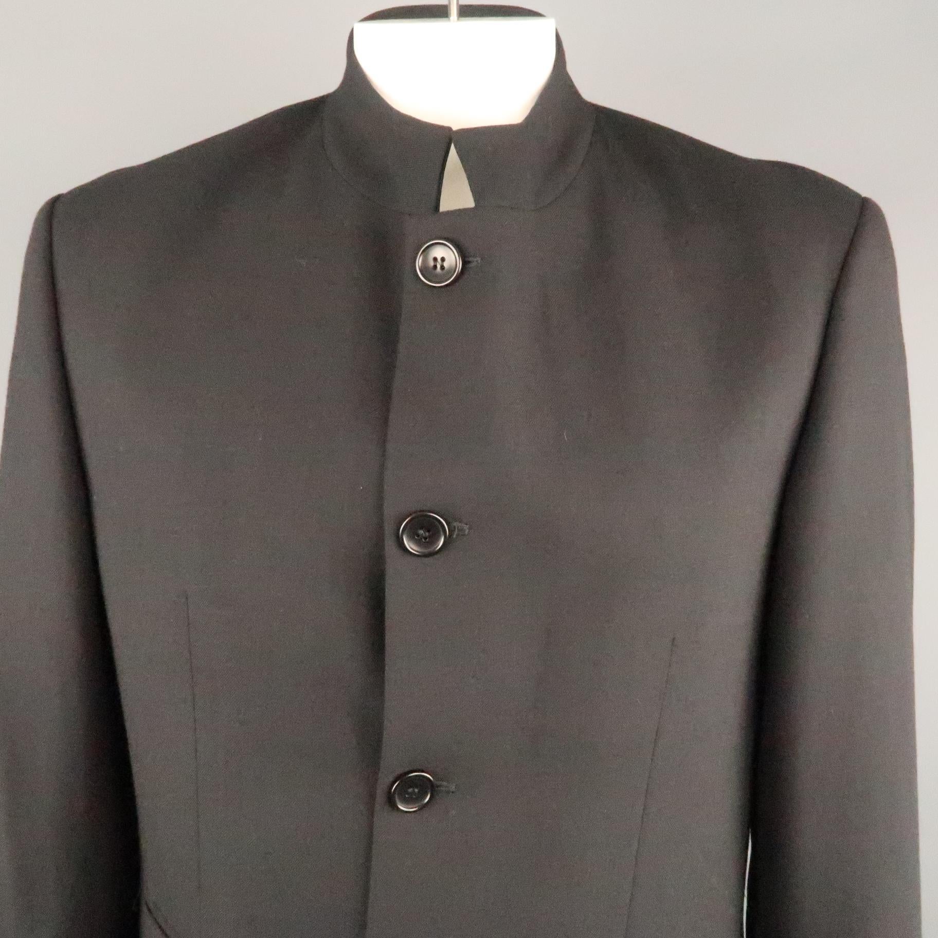 MONDO DI MARCO sport coat comes in a black wool featuring a nehru collar, button closure, and flap pockets. Made in Italy.
 
Excellent Pre-Owned Condition.
Marked: IT 42
 
Measurements:
 
Shoulder: 20 in.
Chest: 38 in.
Sleeve: 25 in.
Length: 33 in.