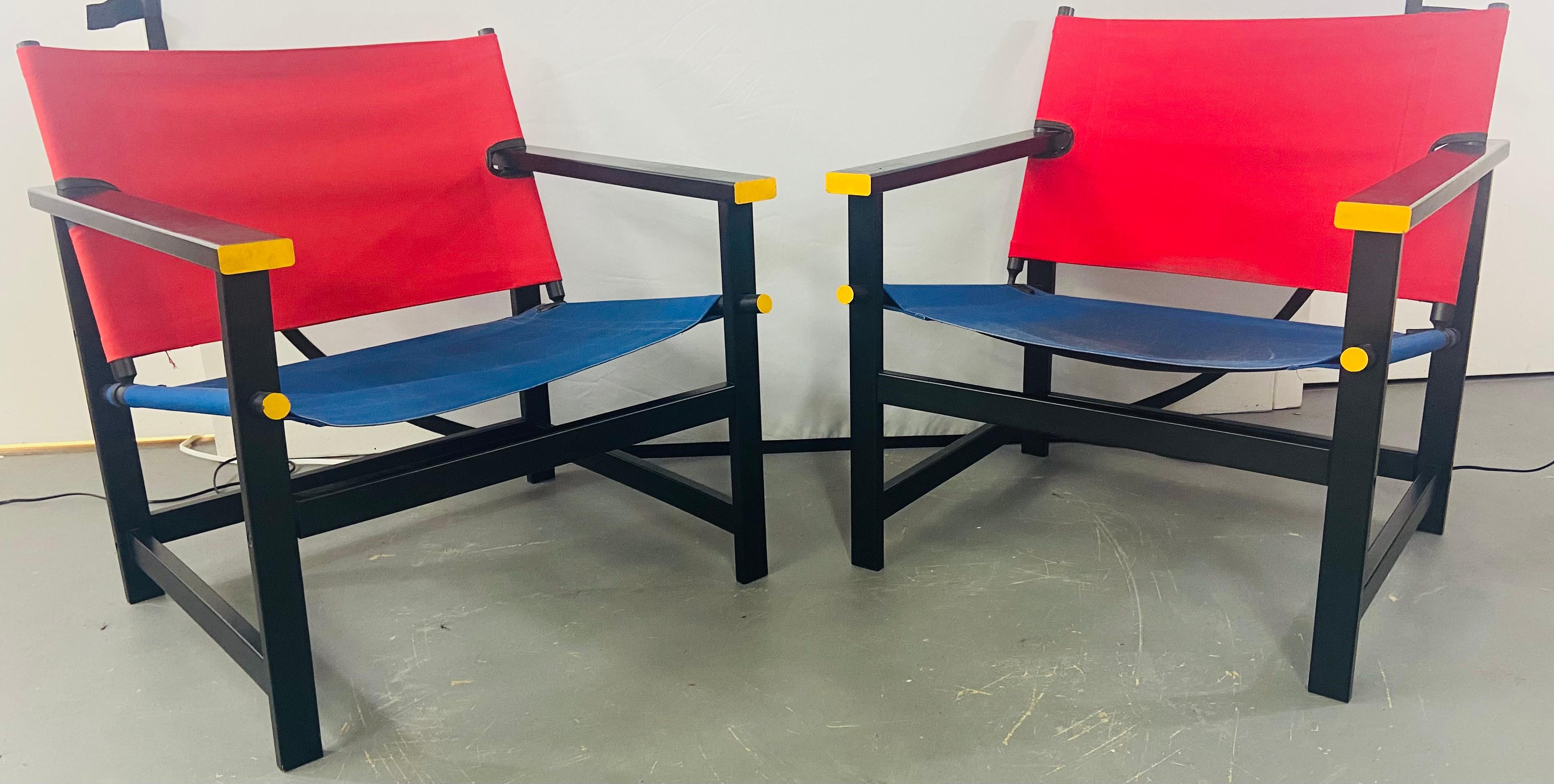 A stylish and comfortable pair of Mondrian red and blue sling chairs in the manner of Gerrit T Rietveld. The iconic design was created in 1918 in Netherlands and is associated with the dutch De Stijl art and architecture movement founded by Piet