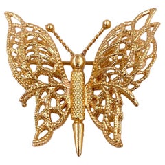 Spilla a farfalla in oro di Monet