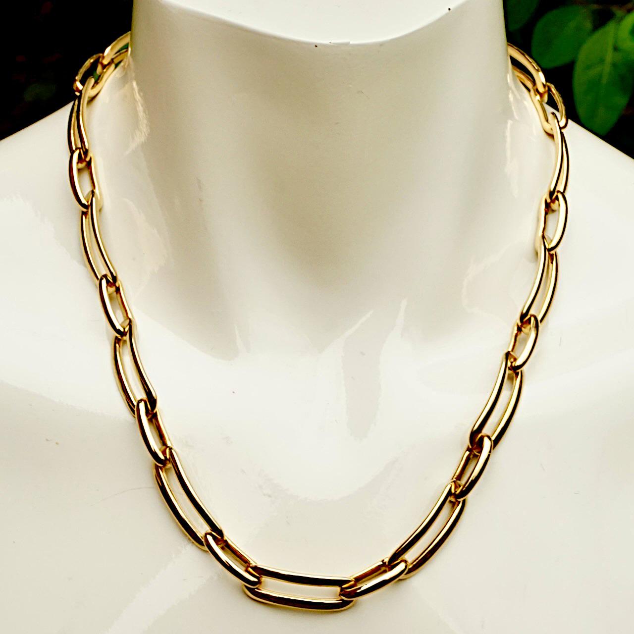 Monet 22ct triple gold plated chain necklace with oblong links. Measuring length 48.5 cm / 19 inches by width 1 cm / .39 inch. The chain has an adjustable double clasp which reduces the length to 40.8 cm / 16 inches. The necklace is in very good