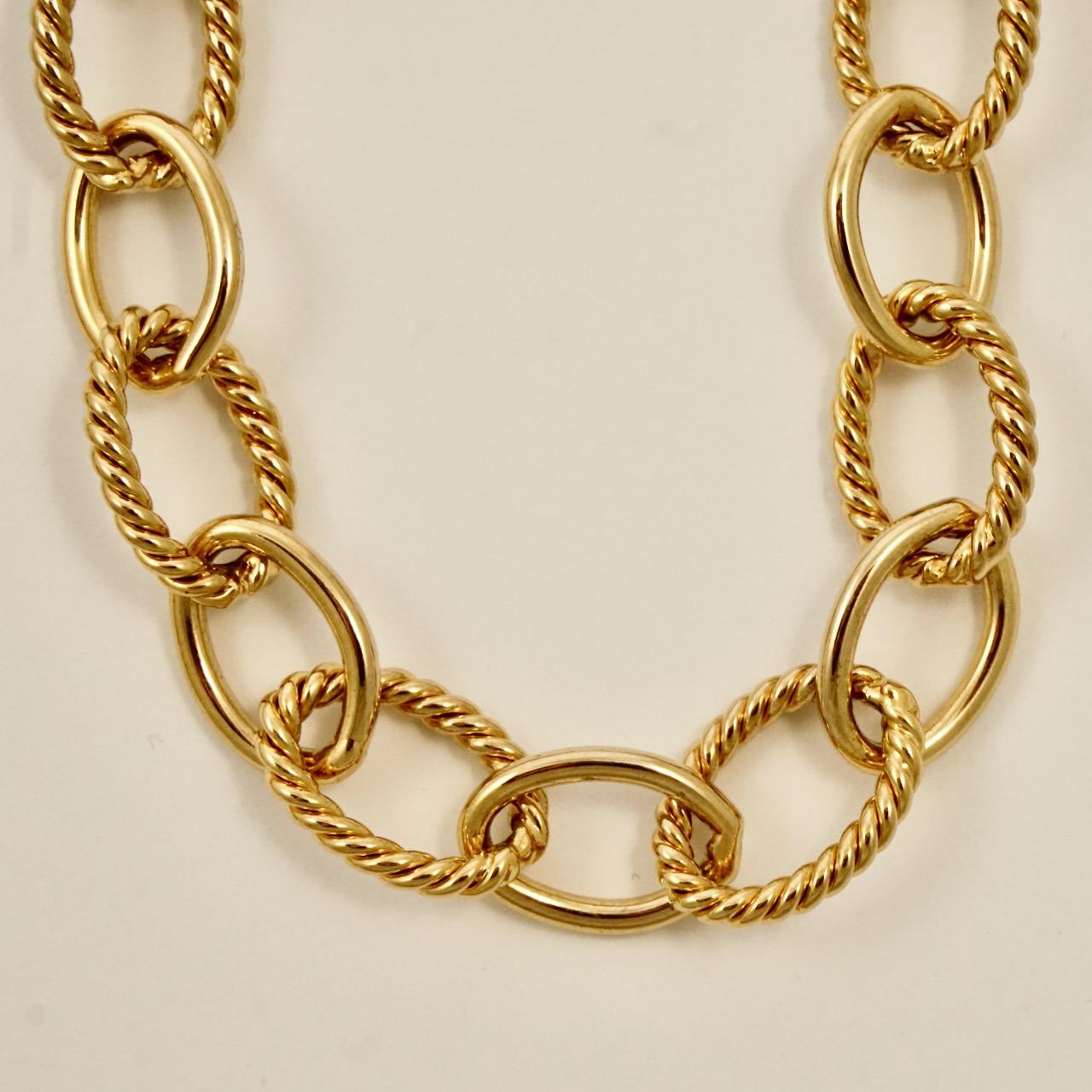 Monet 22ct triple gold plated chain necklace with rope twist and plain shiny oval links. Measuring length 86.5 cm / 34 inches, including the extension chain, by width 1 cm / .39 inch. The necklace is in very good condition.

This is a wonderful