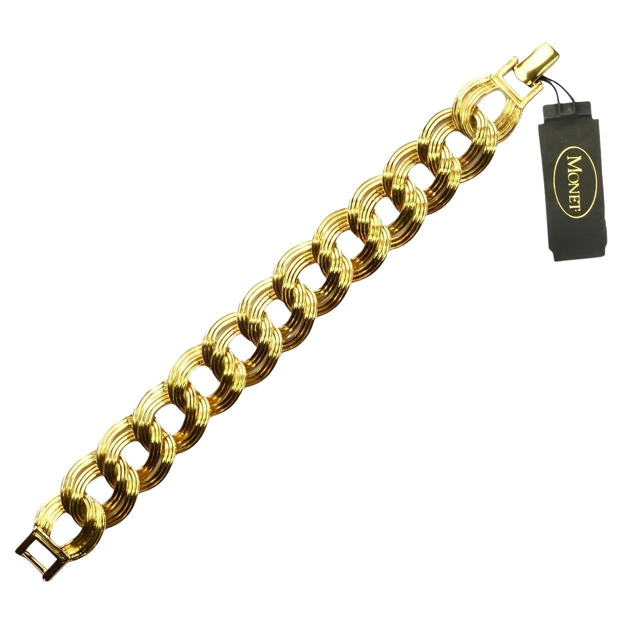 Monet gold plated double link ridged design bracelet. It has the original tag, and is in very good condition.

Measuring length 19.3 cm / 7.6 inches by width 1.9 cm / .75 inch.

This is a lovely high quality Monet bracelet for every day or a special