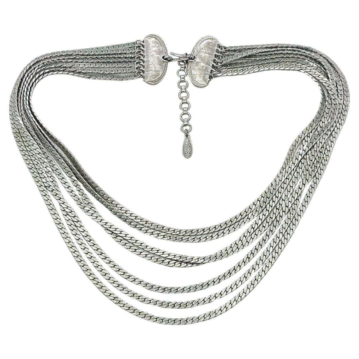 This is a Monet multi-strand chain necklace. This vintage necklace comes with seven strands of 0.125