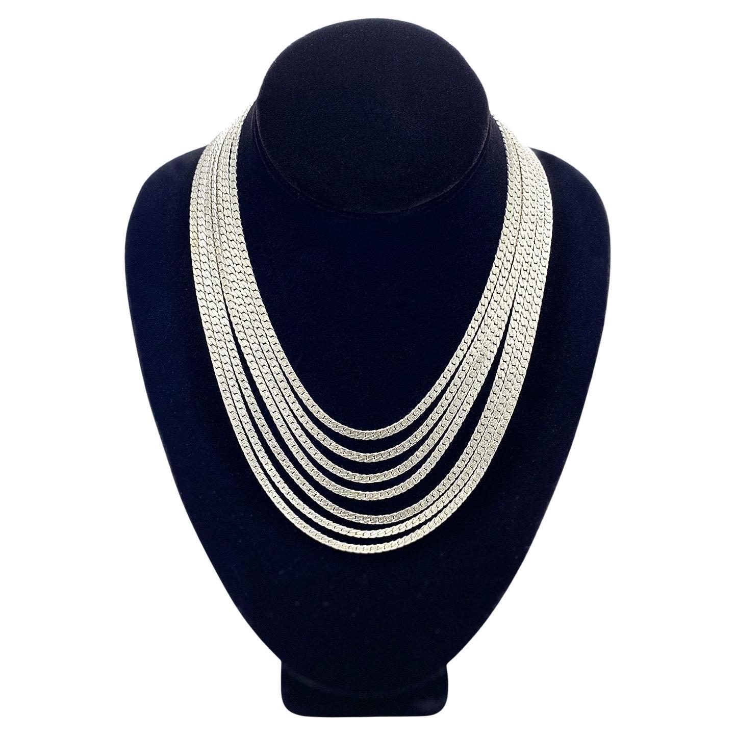 This is a Monet multi-strand chain necklace. This vintage necklace comes with seven strands of 0.125