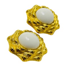 MONET signed gold tone white lucite designer clip on earrings