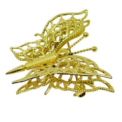Spilla vintage firmata Monet con farfalla in tonalità oro