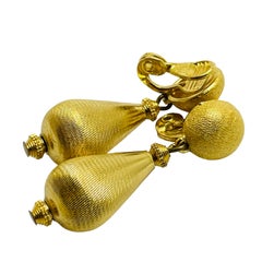 MONET signed vintage gold tone designer dangle clip on earrings