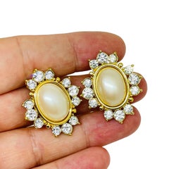 MONET signed vintage gold tone faux pearl rhinestone designer clip on earrings
