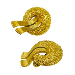 MONET signed vintage gold tone textured designer clip on earrings