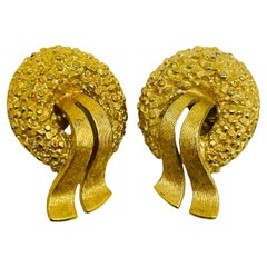 MONET signed vintage gold tone textured designer clip on earrings
