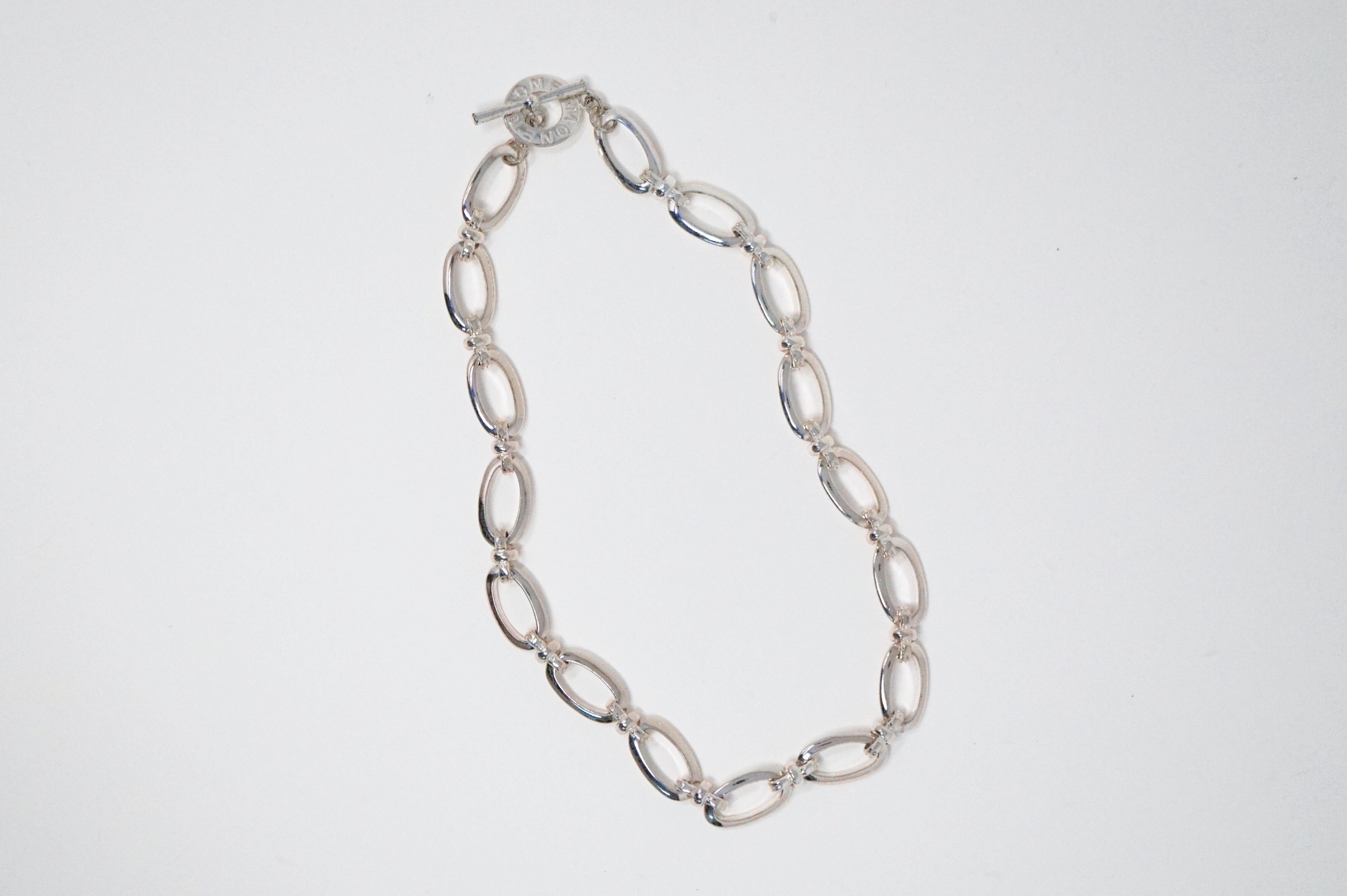 This beautiful vintage silver tone chunky chain by Monet is an everyday go-to accessory that you'll find yourself reaching for again and again.  With a shiny silver tone finish, this essential piece has a branded Monet toggle clasp in the style of