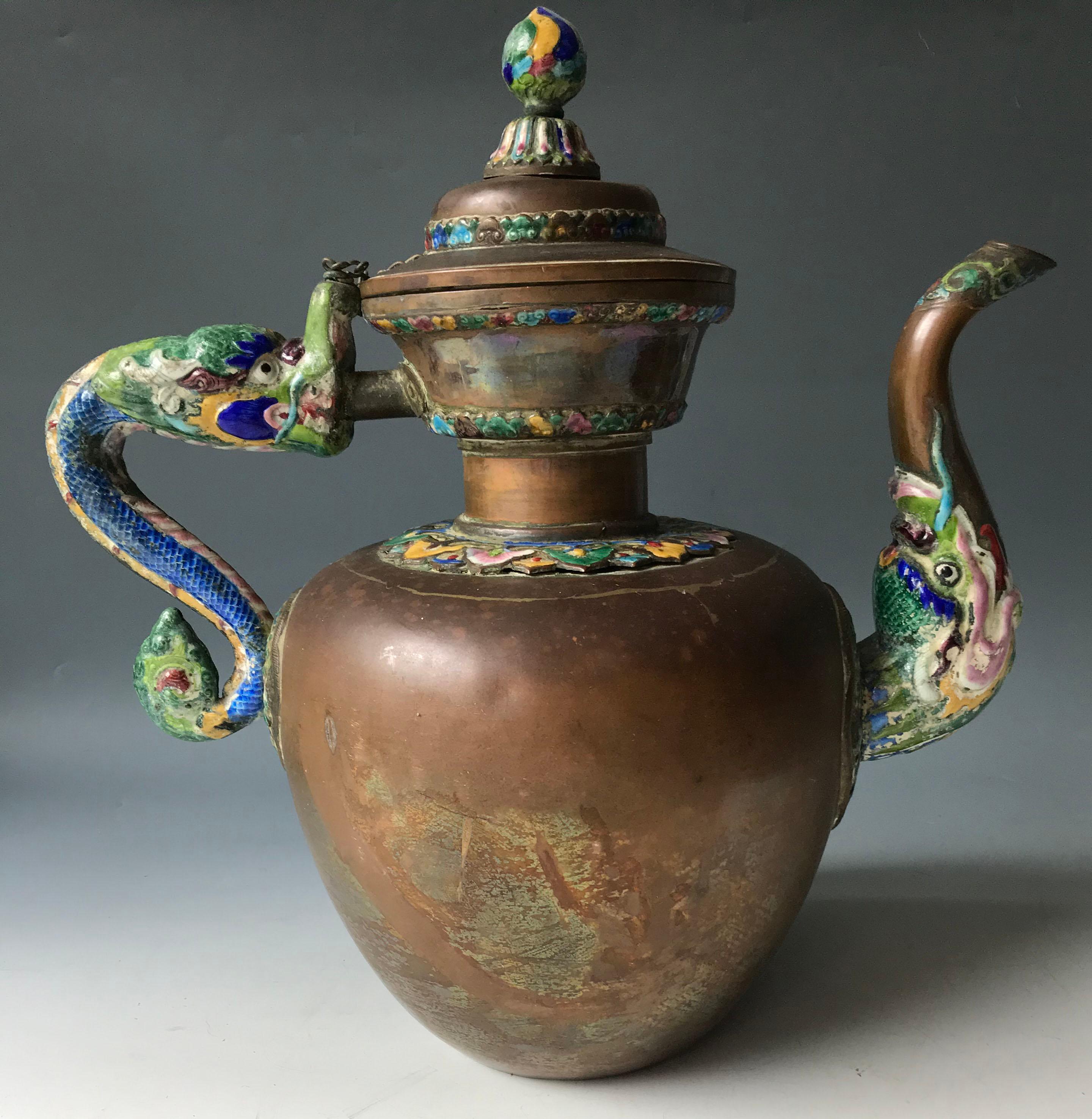 A Mongolian-Chinese copper brass Enamel teapot Circa /19th century
A fine rare Large handsome teapot of bulbous form with colourful enamelled dragon handle and spout and enamelling on body and lid
Period: 18th early 19th century
Measure: H 35