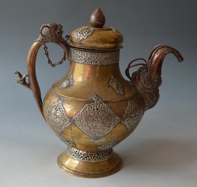 https://a.1stdibscdn.com/mongolian-chinese-antique-copper-brass-silver-teapot-asian-tibetan-antiques-for-sale-picture-2/f_64602/f_341435121683287910324/DSC_0790_master.jpg?width=768