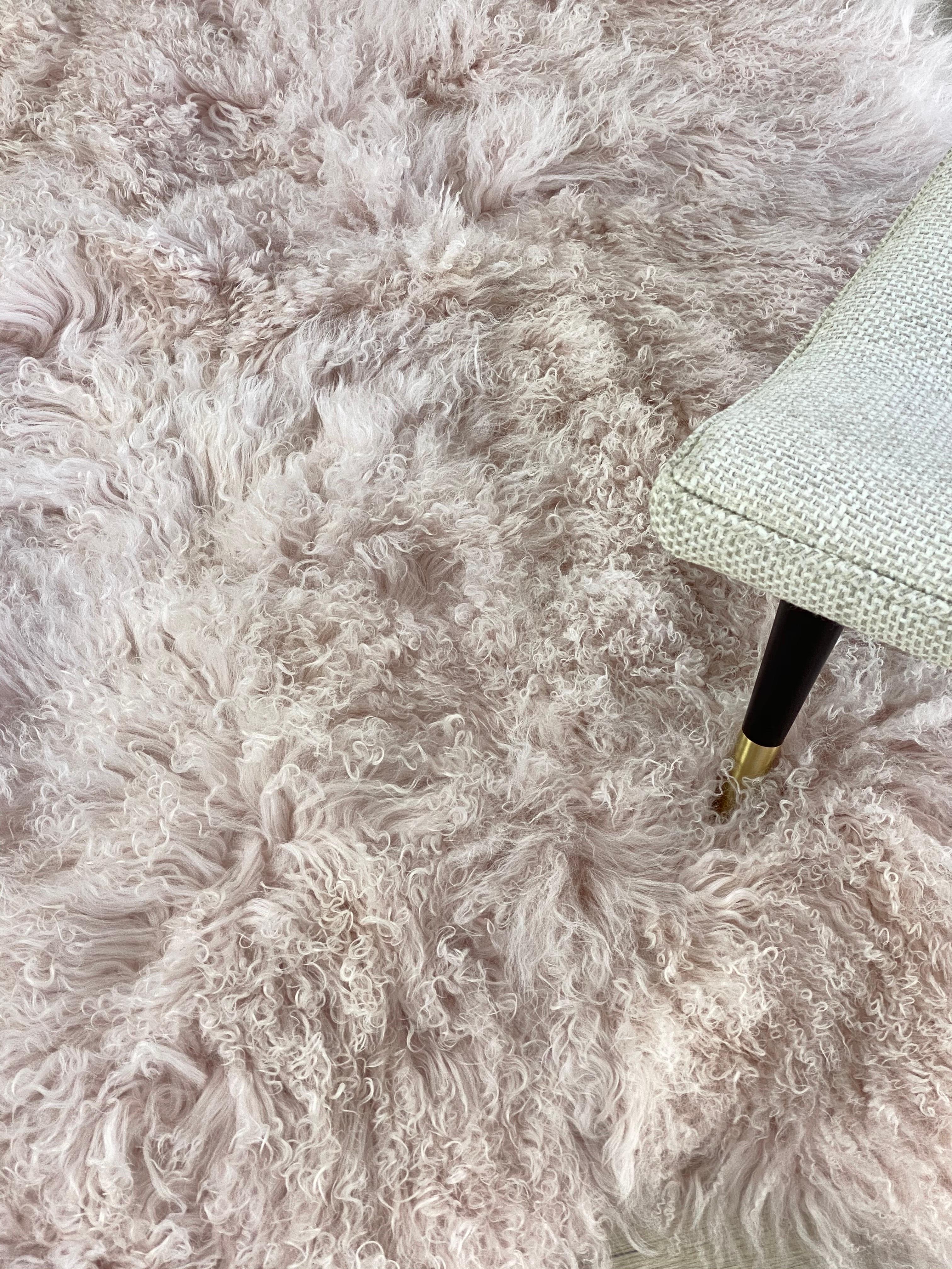 From gentle softness to sustainable design, this enchanting Mongolian fur rug translates modern and stylish design paralleled with an expression of natural signature living. 

Featured in a beautiful blush pink color, enhancing the irresistibly