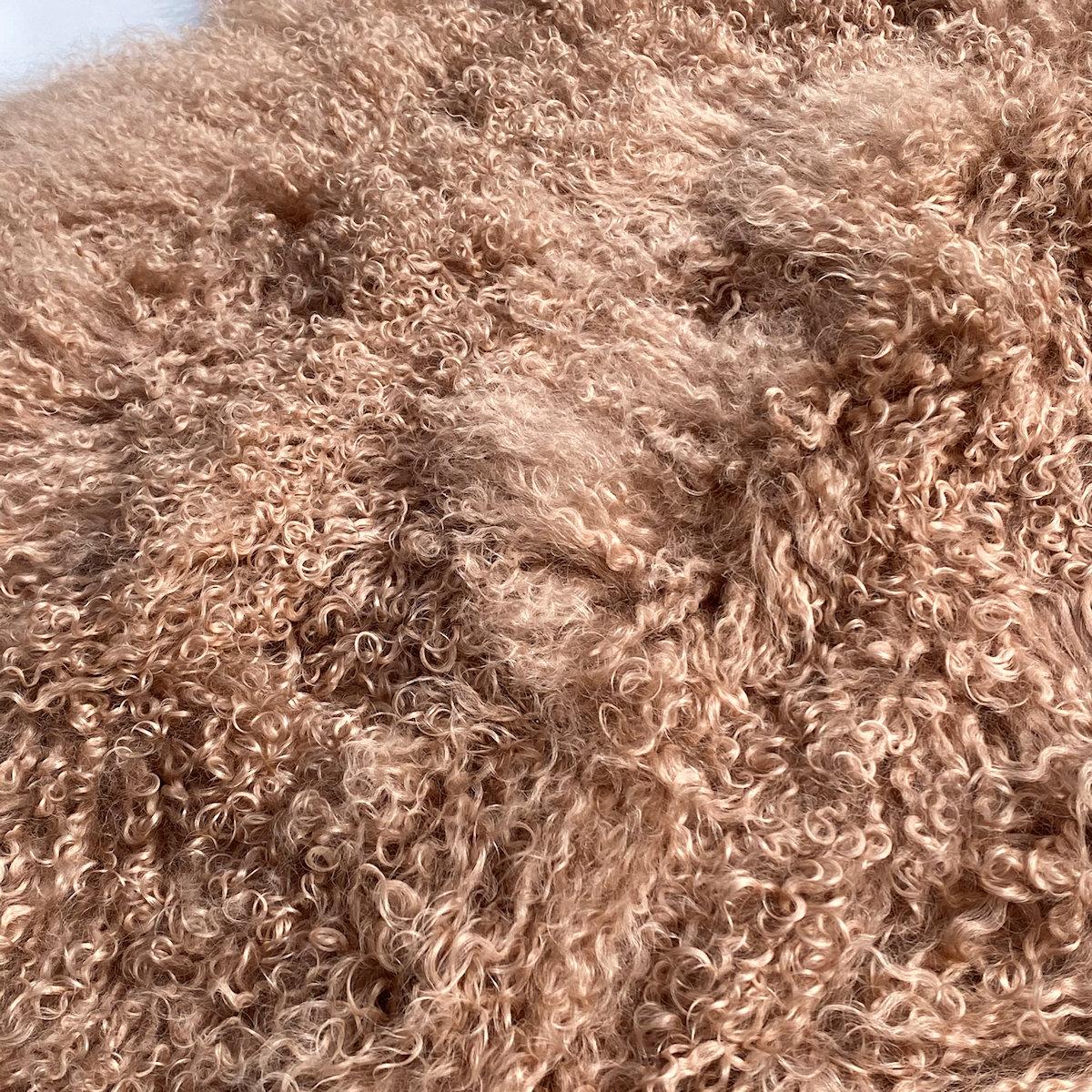 Elevate the luxury of your decor with this Mongolian Fur rug. Whether styling a nursery or adding luxury elements to a bedroom, this exquisite pink fur rug will uplift the elegance and ambiance of your room. This piece gives you versatility in